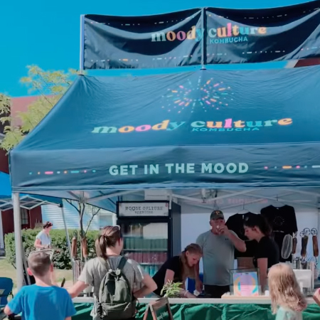 A gable-style pop-up tent for Moody Culture Kombucha