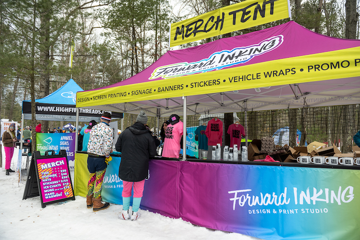 A custom retail tent at an outdoor event in the winter.