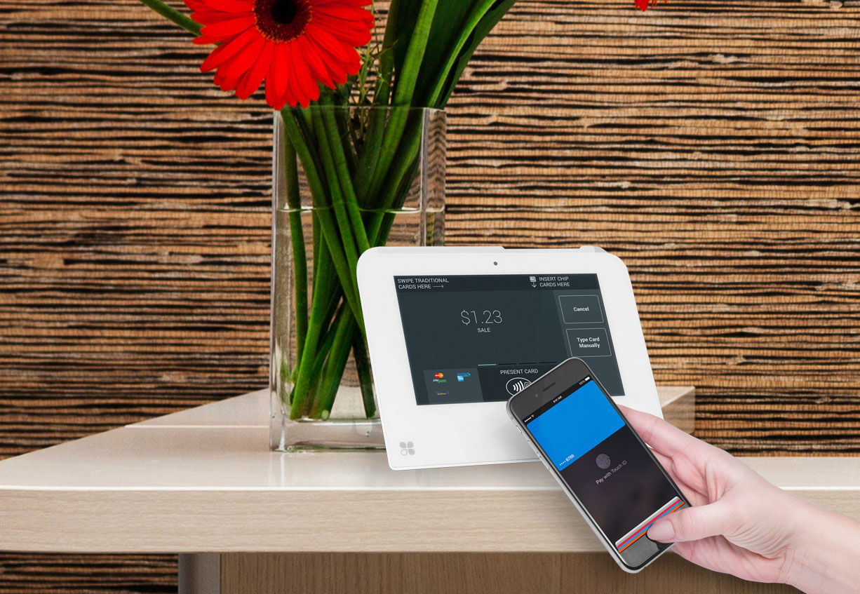 tablet and phone checkout system on table with flowers