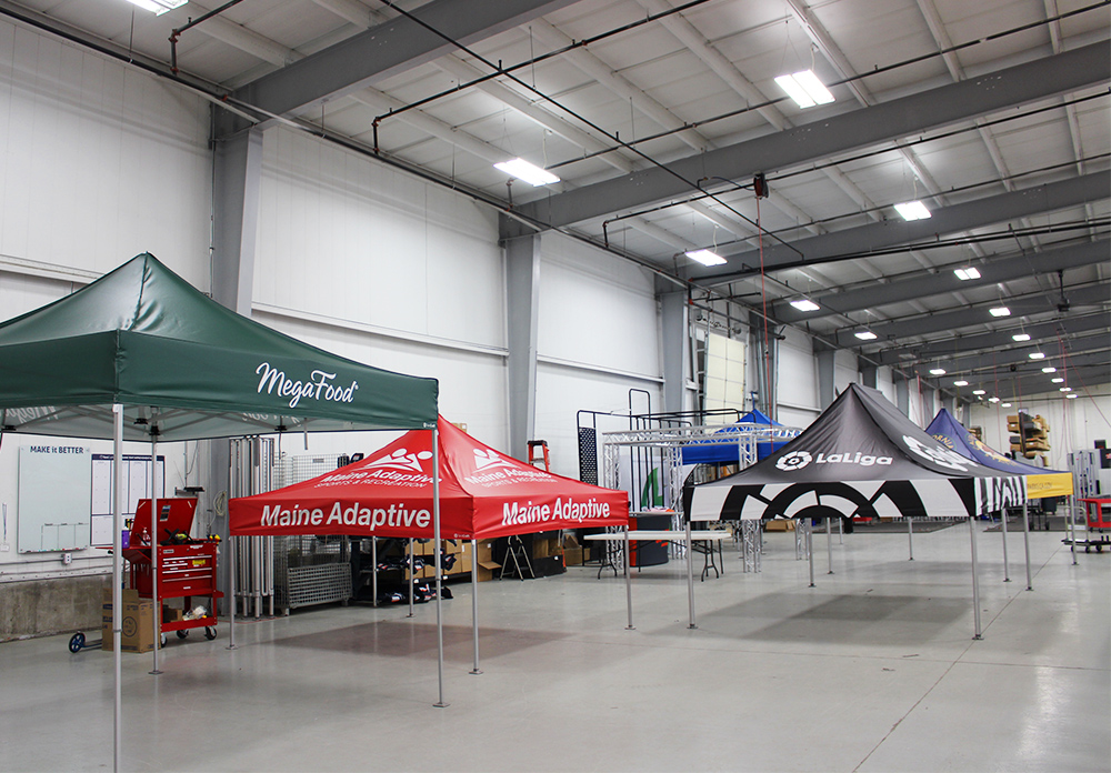 Five MONARCHTENTS in the TentCraft warehouse awaiting quality assurance review.
