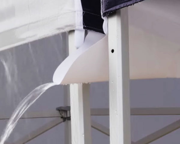 An easy to assemble tent gutter system attached to two pop-up tents.