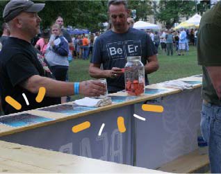 Wood countertops attached to a heavy-duty pop-up tent frame.