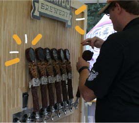 Beer taps installed on custom beer festival pop-up tent.