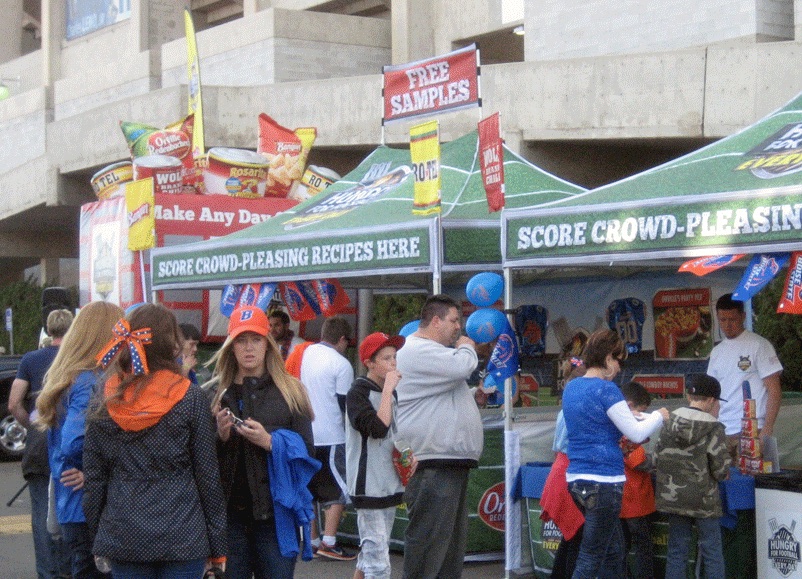 A 10x15 heavy-duty pop-up tent used at festival for food sampling.